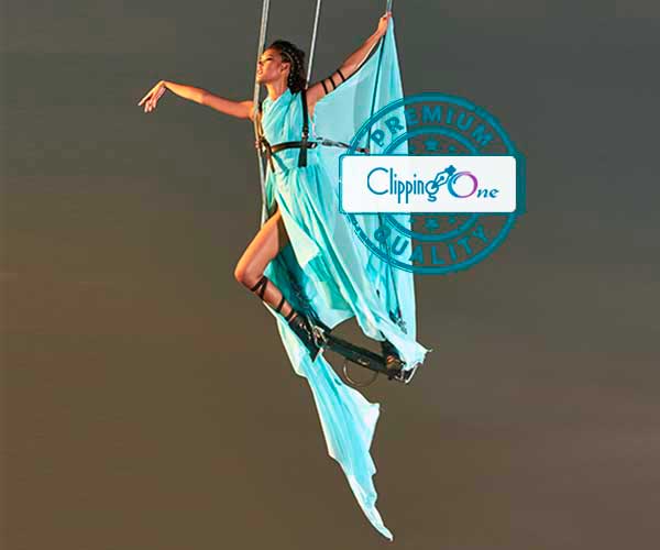 Women performing aerial silks hanging with special fabric color changes
