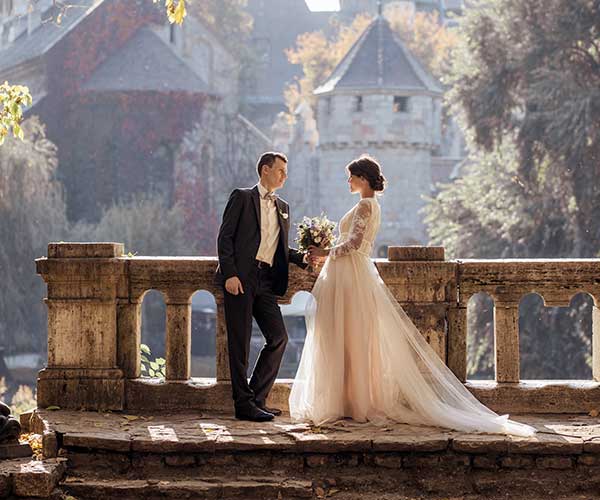 Wedding photo editing after visual woman in white wedding dress stands in front of man in tuxedo
